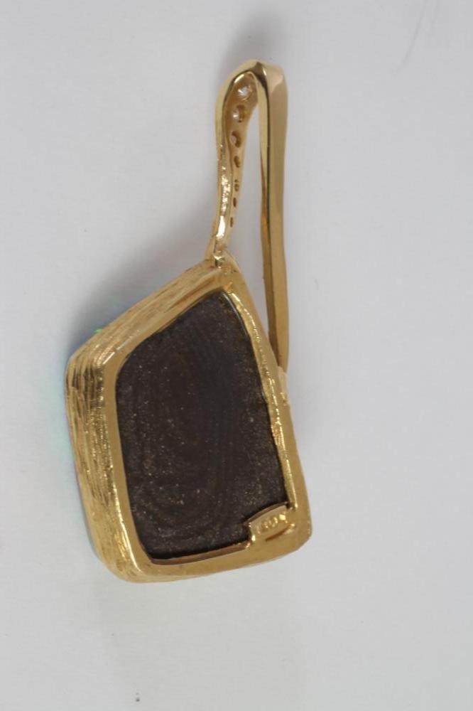 A MODERN OPAL AND DIAMOND PENDANT Image