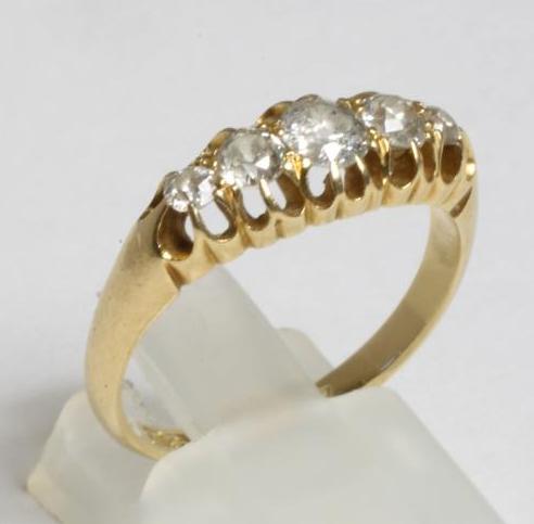 AN EDWARDIAN FIVE STONE DIAMOND RING Image