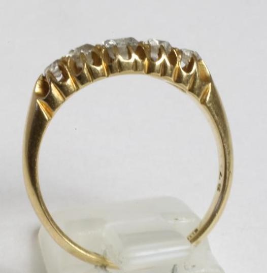 AN EDWARDIAN FIVE STONE DIAMOND RING Image