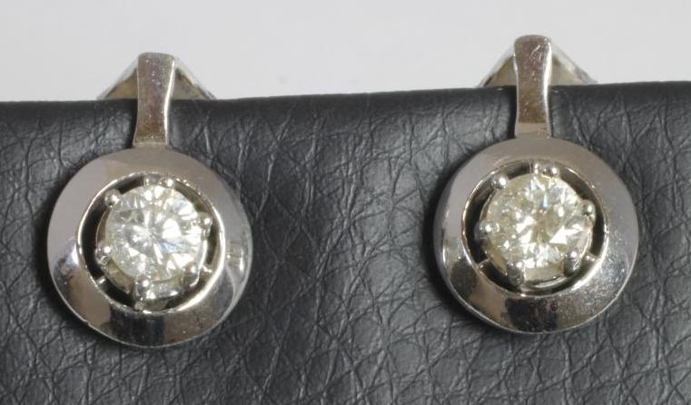 A PAIR OF DIAMOND STUD EARRINGS Image