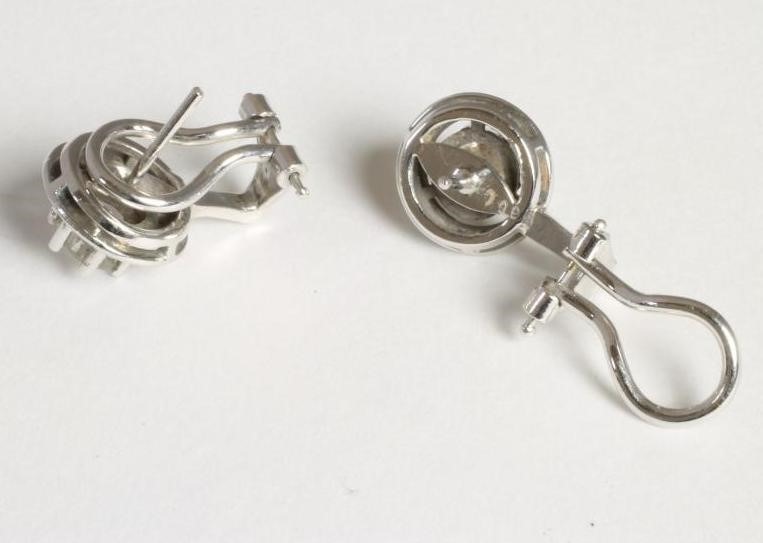 A PAIR OF DIAMOND STUD EARRINGS Image