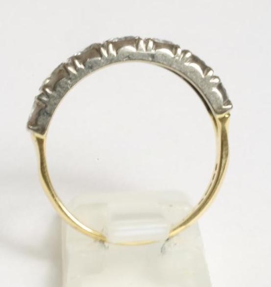 A SEVEN STONE DIAMOND HALF HOOP RING Image