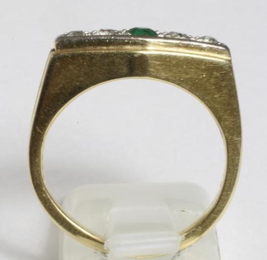 A FIVE STONE EMERALD AND DIAMOND RING Image