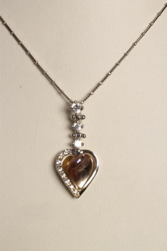 A DIAMOND SET TWO TONE 14CT GOLD HEART PENDANT Image