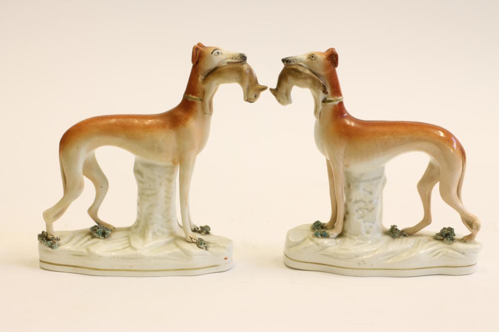 A PAIR OF VICTORIAN STAFFORDSHIRE POTTERY GREYHOUNDS Image