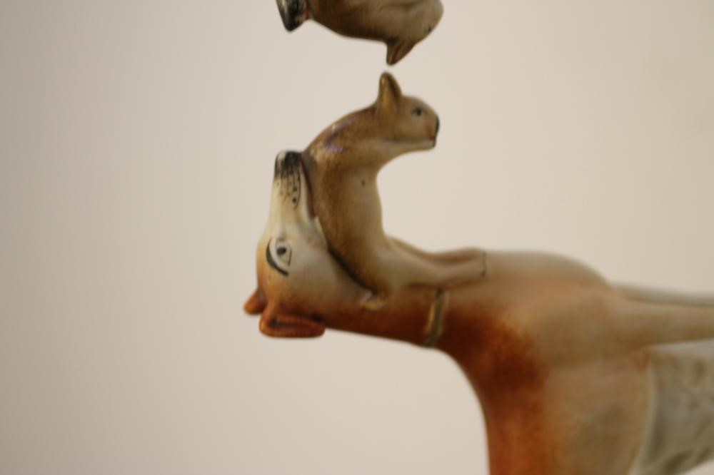 A PAIR OF VICTORIAN STAFFORDSHIRE POTTERY GREYHOUNDS Image