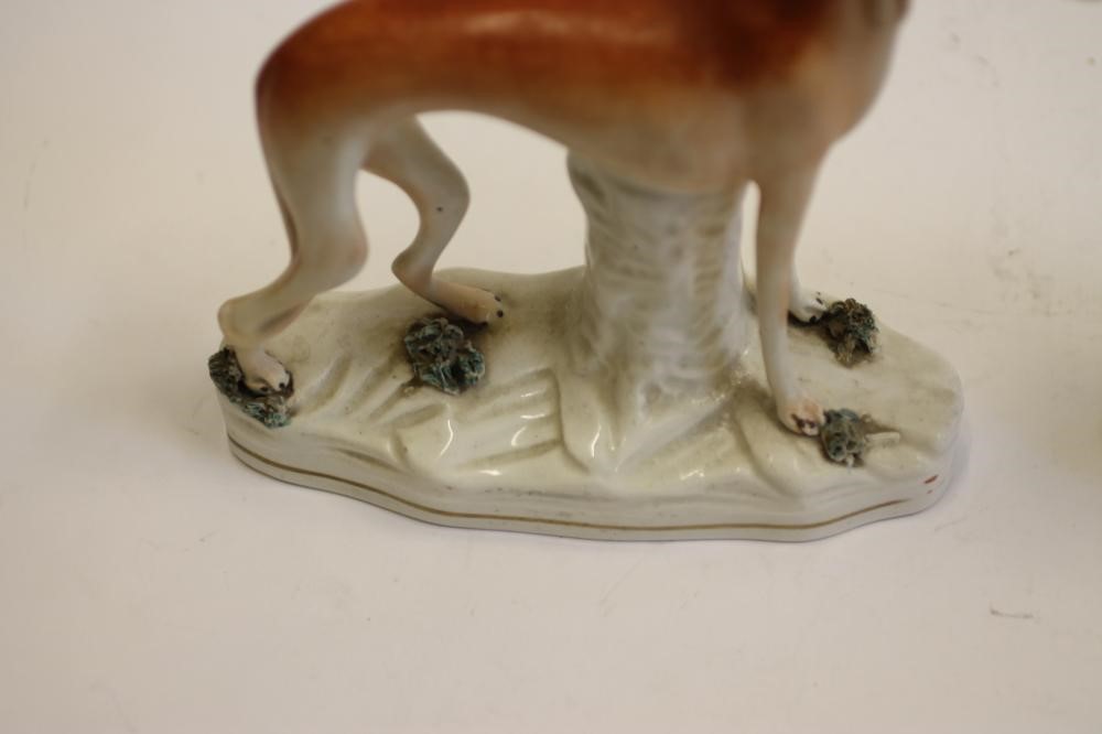 A PAIR OF VICTORIAN STAFFORDSHIRE POTTERY GREYHOUNDS Image