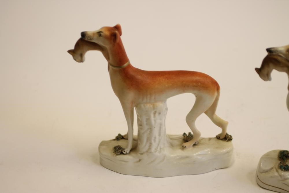 A PAIR OF VICTORIAN STAFFORDSHIRE POTTERY GREYHOUNDS Image