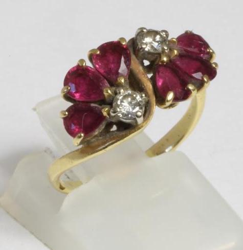A RUBY AND DIAMOND CROSSOVER DRESS RING Image
