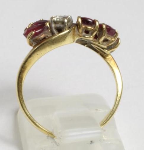 A RUBY AND DIAMOND CROSSOVER DRESS RING Image