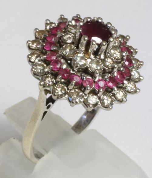 A RUBY AND DIAMOND CLUSTER COCKTAIL RING Image