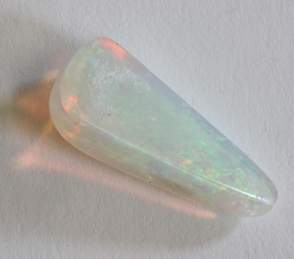 A POLISHED OPAL of triangular form and of approximately 15cts Image