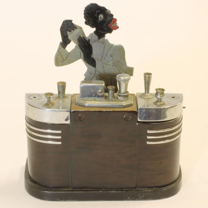 A RONSON ART DECO CHROME TABLE LIGHTER modelled as a cocktail bar with central lighter flanked by a Image