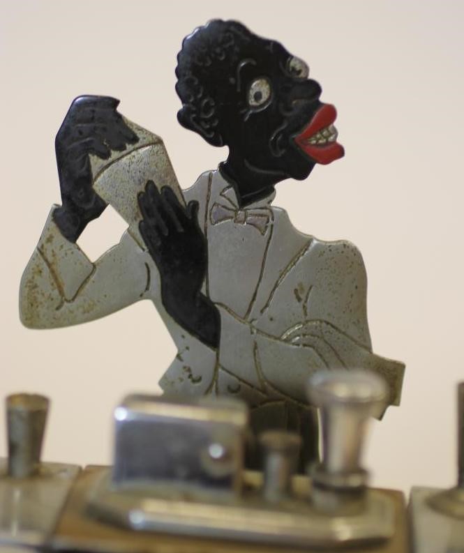 A RONSON ART DECO CHROME TABLE LIGHTER modelled as a cocktail bar with central lighter flanked by a Image