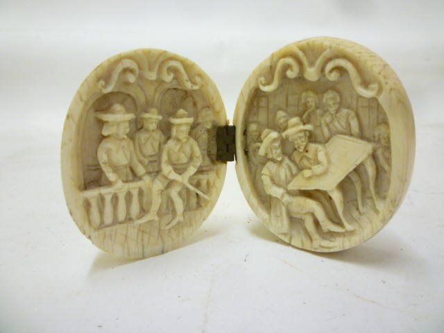 A EUROPEAN IVORY EGG SHAPED TRIPTYCH Image
