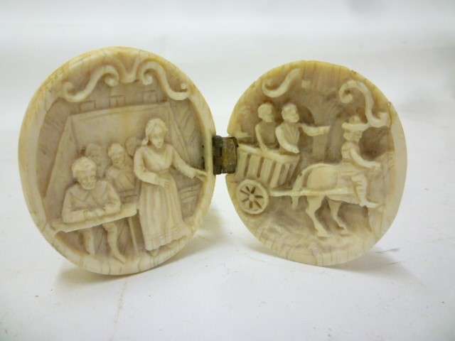 A EUROPEAN IVORY EGG SHAPED TRIPTYCH Image
