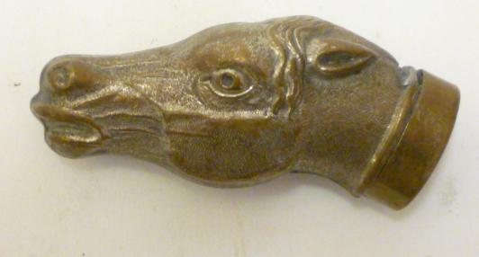A VICTORIAN BRASS NOVELTY VESTA stamped as a horse's head with hinged cover/strike Image
