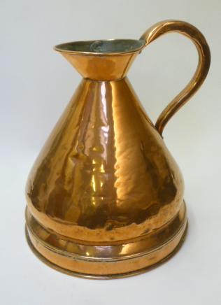 A THREE GALLON COPPER MEASURE of typical haystack form with moulded base Image