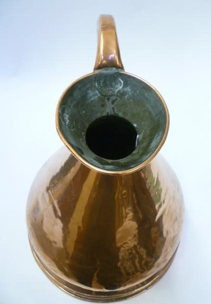 A THREE GALLON COPPER MEASURE of typical haystack form with moulded base Image