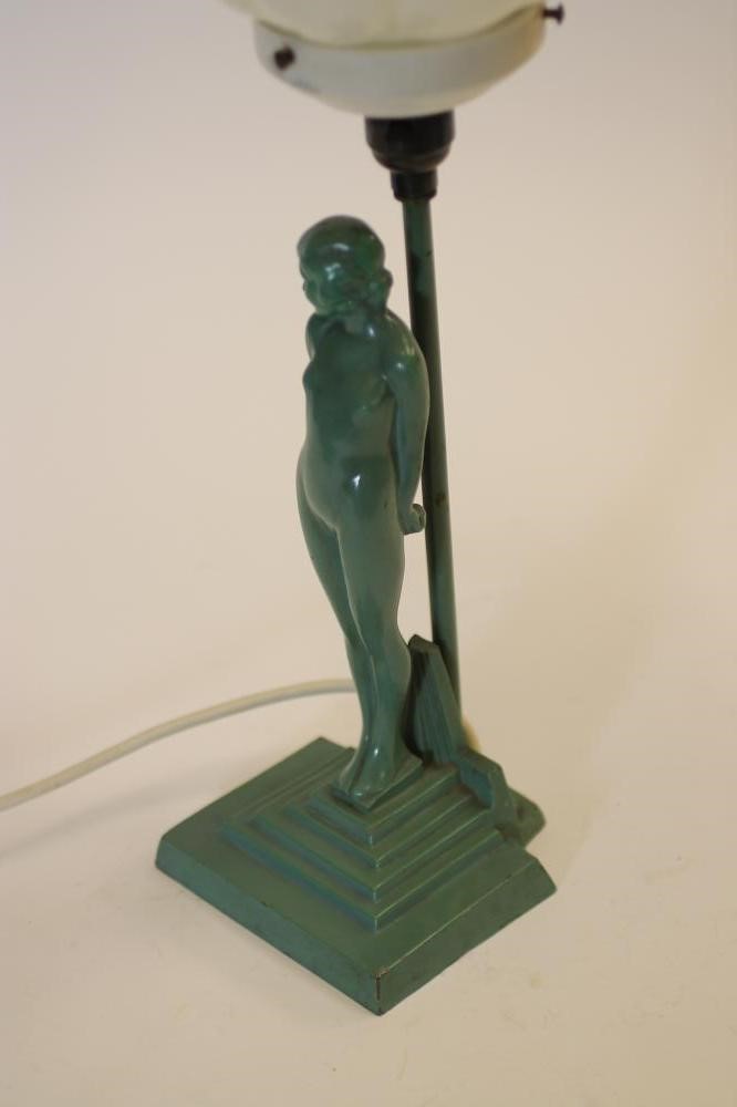AN ART DECO FIGURAL TABLE LAMP of a naked young girl standing beside a post on a stepped base Image