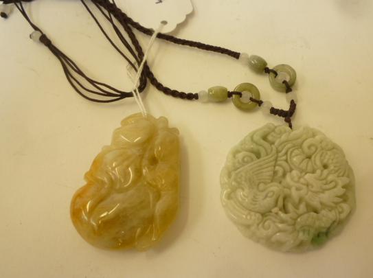 TWO CHINESE JADE PENDANTS Image