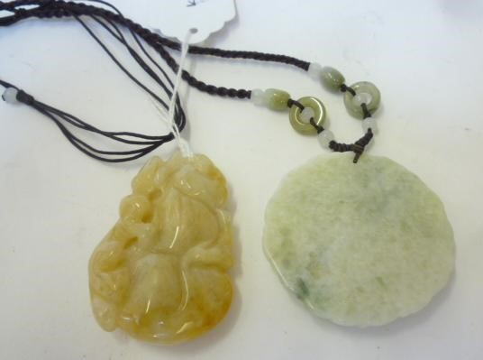 TWO CHINESE JADE PENDANTS Image