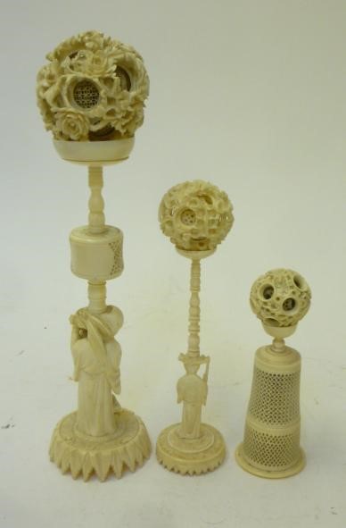 THREE CHINESE IVORY PUZZLE BALLS AND STANDS Image