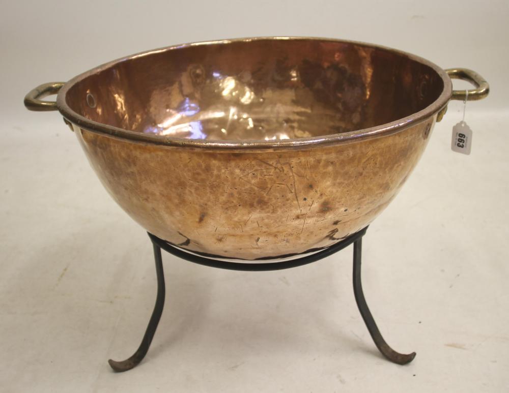 A VICTORIAN COPPER PAN of circular round bottomed form Image
