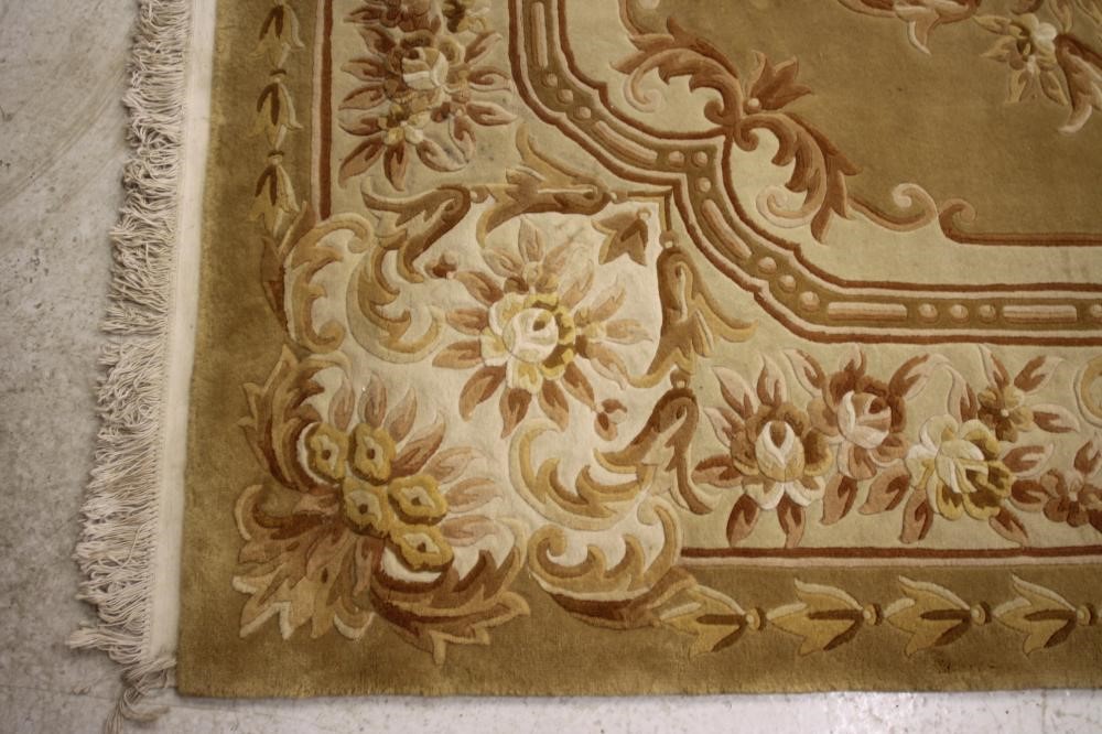 A CHINESE WASHED AND FRINGED CARPET Image