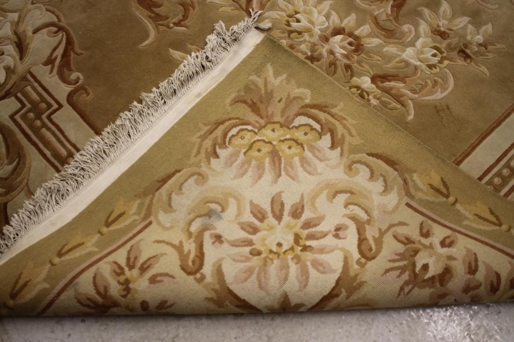 A CHINESE WASHED AND FRINGED CARPET Image