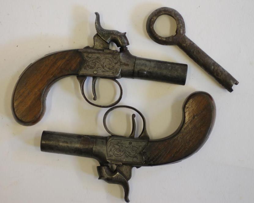 A PAIR OF PERCUSSION MUFF PISTOLS Image