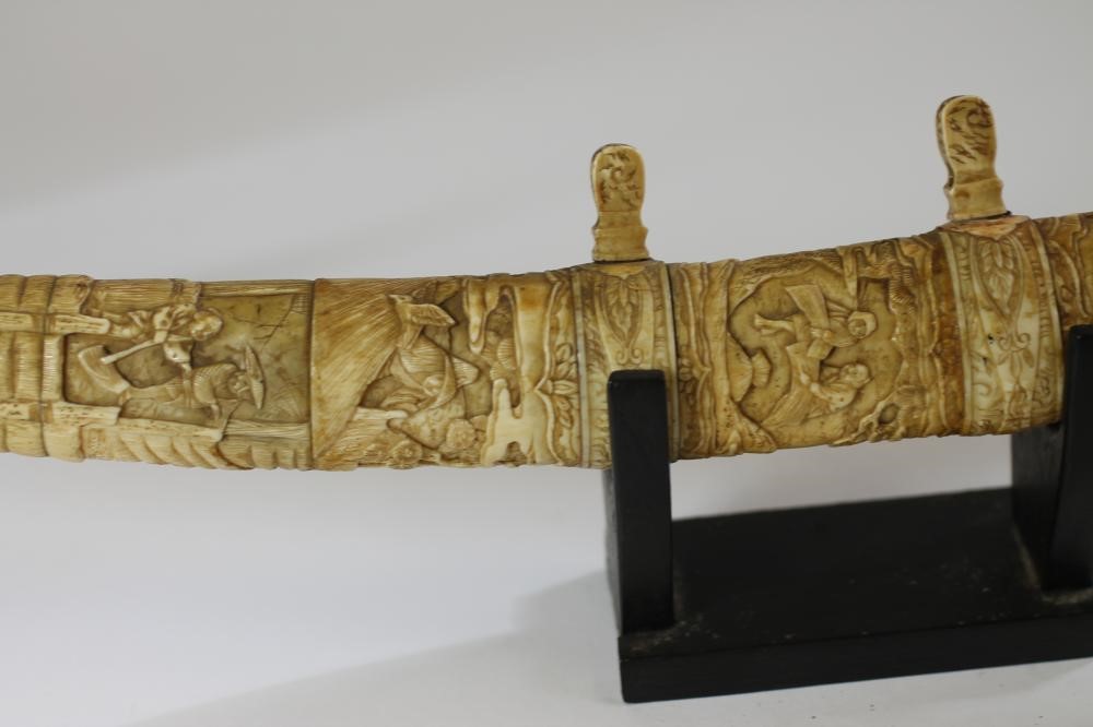 A JAPANESE CARVED MARINE IVORY MOUNTED WAKIZASHI Image