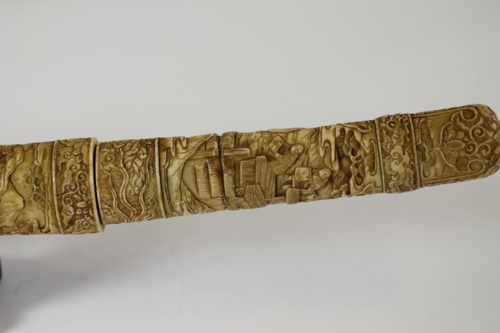 A JAPANESE CARVED MARINE IVORY MOUNTED WAKIZASHI Image