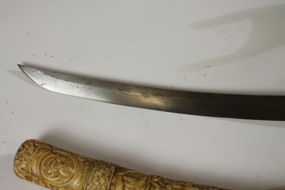 A JAPANESE CARVED MARINE IVORY MOUNTED WAKIZASHI Image