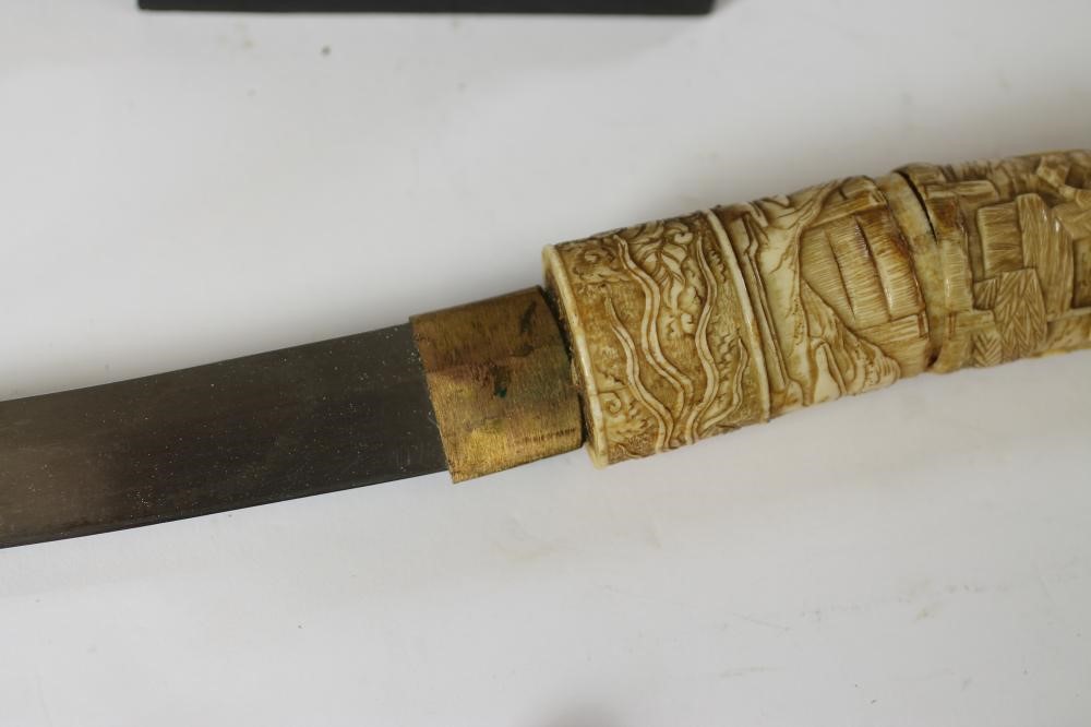 A JAPANESE CARVED MARINE IVORY MOUNTED WAKIZASHI Image