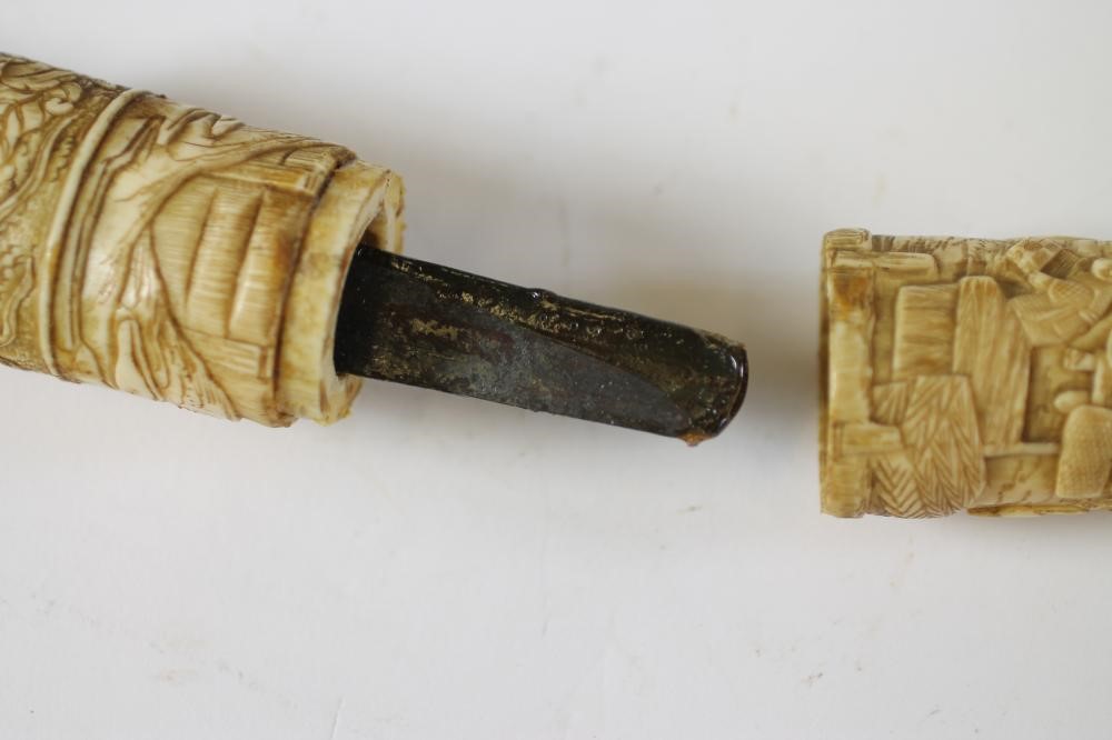 A JAPANESE CARVED MARINE IVORY MOUNTED WAKIZASHI Image