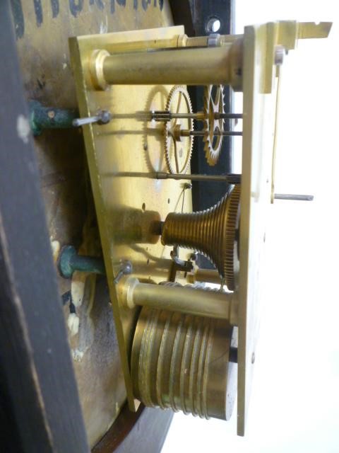 A MAHOGANY WALL CLOCK signed Thornton Image