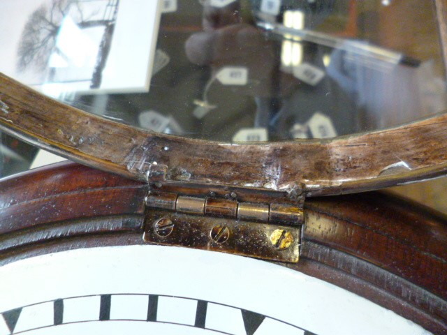 A MAHOGANY WALL CLOCK signed Thornton Image