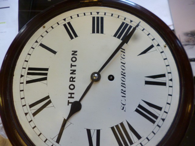 A MAHOGANY WALL CLOCK signed Thornton Image