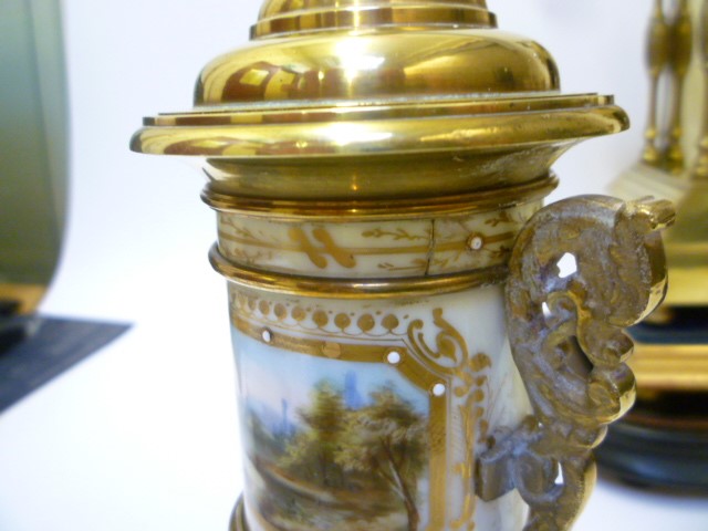 A FRENCH BRASS AND PORCELAIN MANTEL CLOCK GARNITURE Image