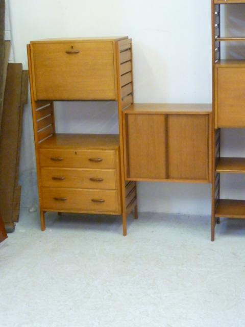 A STAPLES LADDERAX TEAK LIVING ROOM UNIT incorporating shelving Image