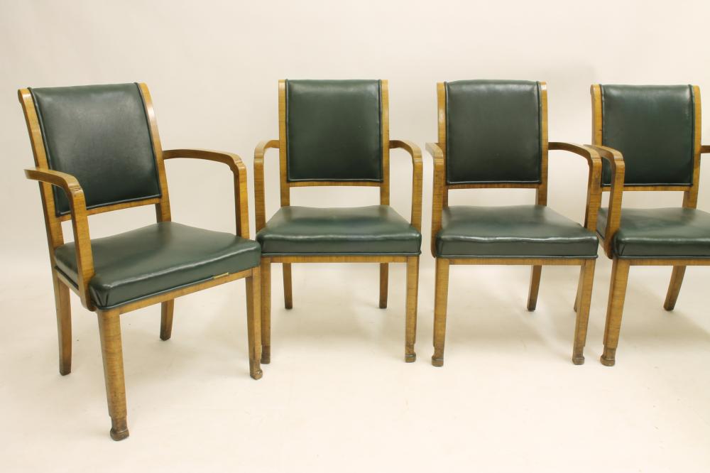 A SET OF SIX ART DECO WALNUT ELBOW CHAIRS upholstered in green leather Image
