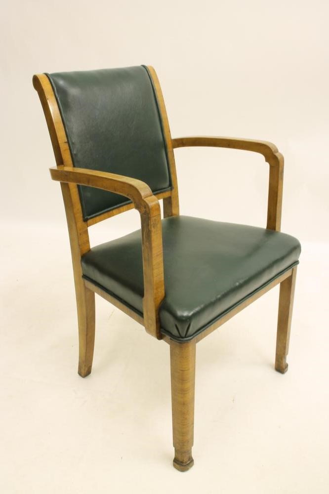 A SET OF SIX ART DECO WALNUT ELBOW CHAIRS upholstered in green leather Image
