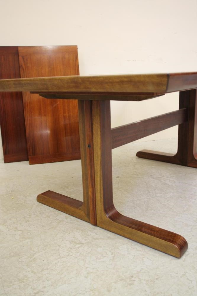 A DANISH SKOVBY ROSEWOOD DINING TABLE of oblong draw leaf form Image