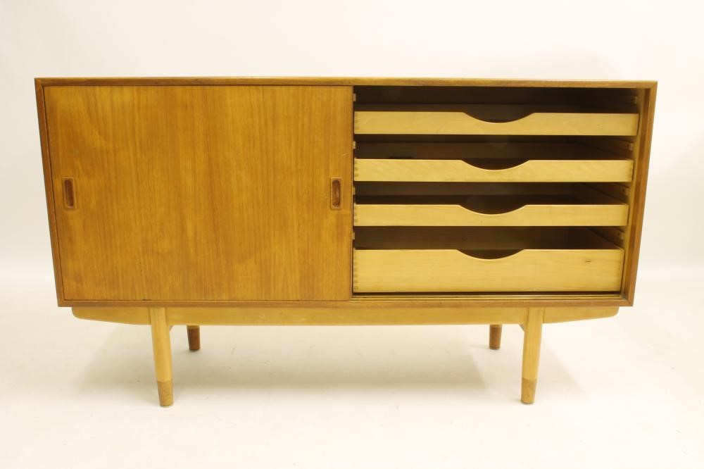 A DANISH BORGE MOGENSEN TEAK SIDEBOARD of oblong form with two sliding doors bearing lug handles and Image