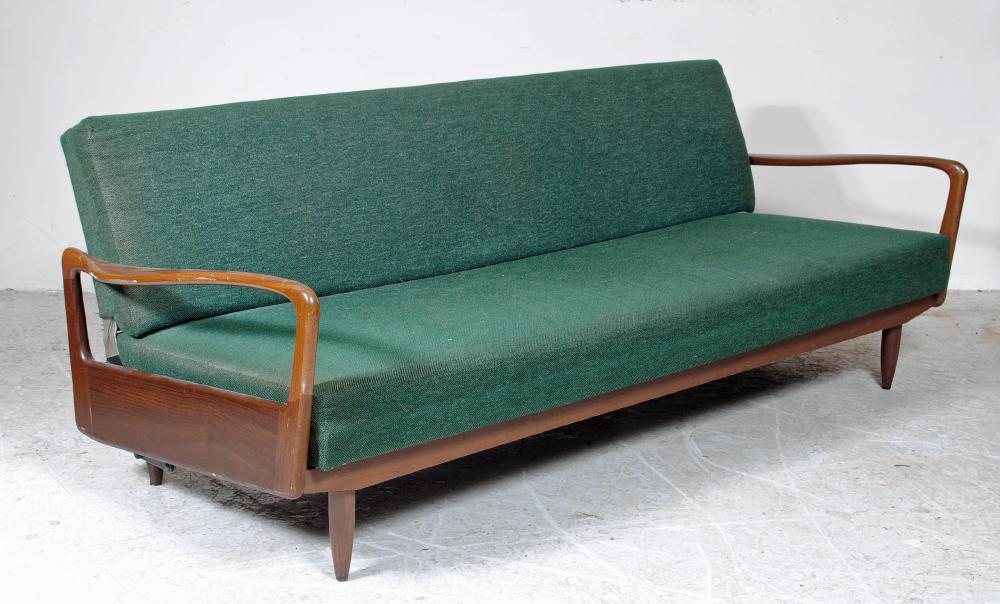 A TEAK FRAMED SOFA BED by Greaves & Thomas upholstered in a green weave Image