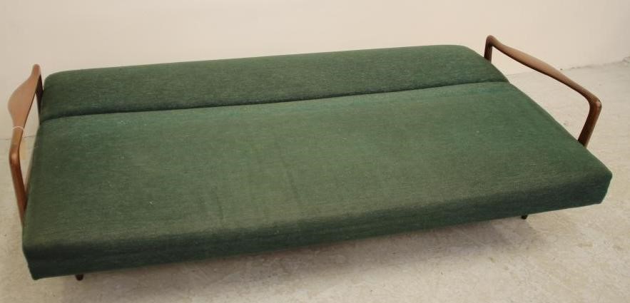 A TEAK FRAMED SOFA BED by Greaves & Thomas upholstered in a green weave Image