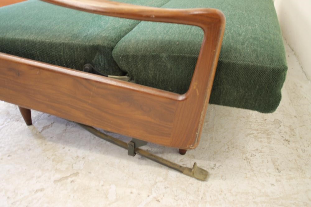 A TEAK FRAMED SOFA BED by Greaves & Thomas upholstered in a green weave Image