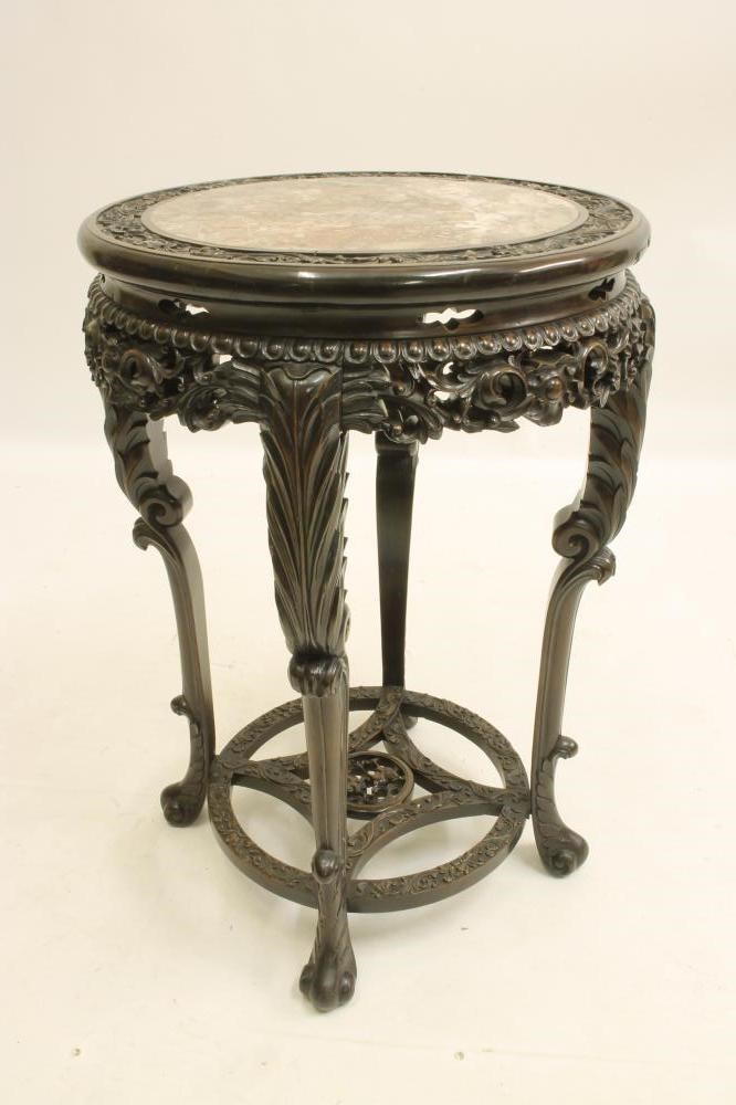 A CHINESE CARVED PADOUK WOOD JARDINIERE STAND Image
