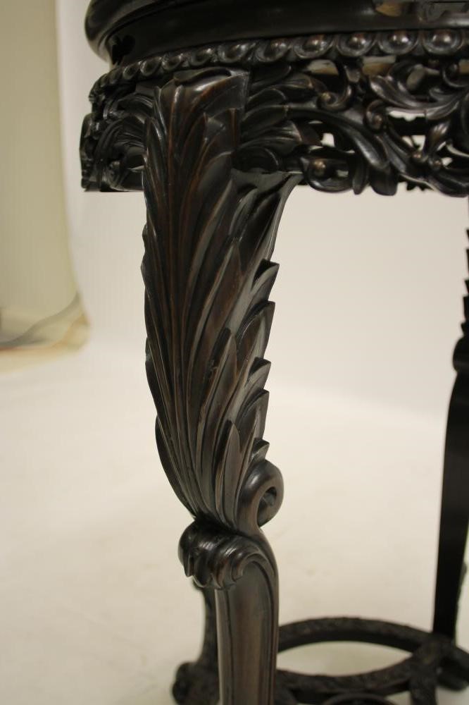 A CHINESE CARVED PADOUK WOOD JARDINIERE STAND Image